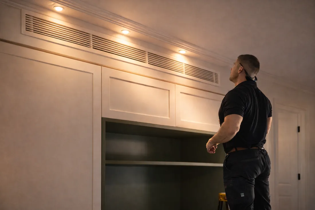 Evercold technician servicing an air conditioning unit